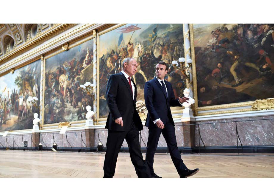 Vladimir Putin and Emmanuel Macron in in Versailles, May 2017. Photograph: Stephane de Sakutin/AFP/Getty