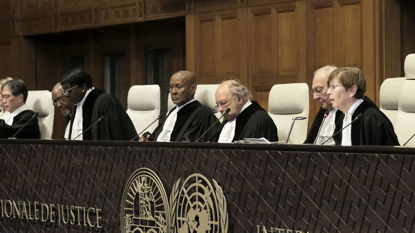 Judges preside over the opening of the hearings at the International Court of Justice in The Hague, Netherlands, Thursday, Jan. 11, 2024. The United Nations' top court opens hearings Thursday into South Africa's allegation that Israel's war with Hamas amounts to genocide against Palestinians, a claim that Israel strongly denies. (AP Photo/Patrick Post)